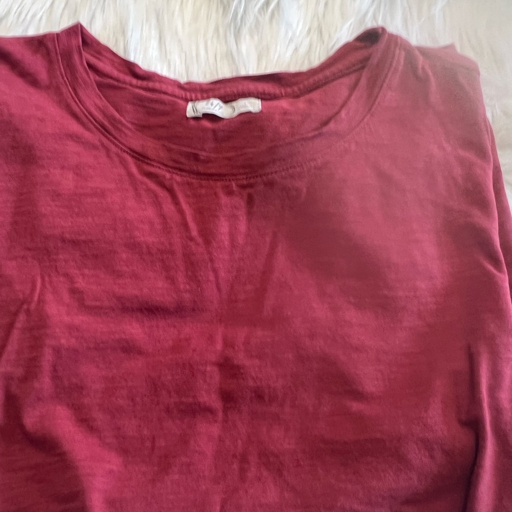 Red tee shirt with a bottom twist
